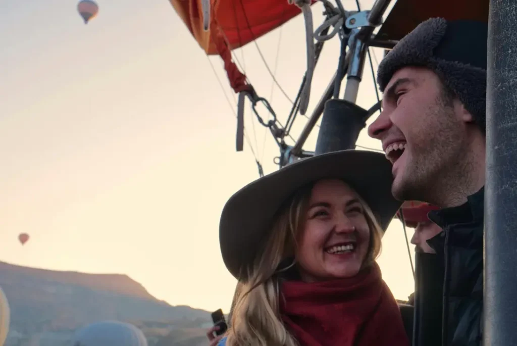 How to Propose to Your Loved One: Top Marriage Proposal Ideas | Take A Vow Stories Couple laughing on hot air balloon